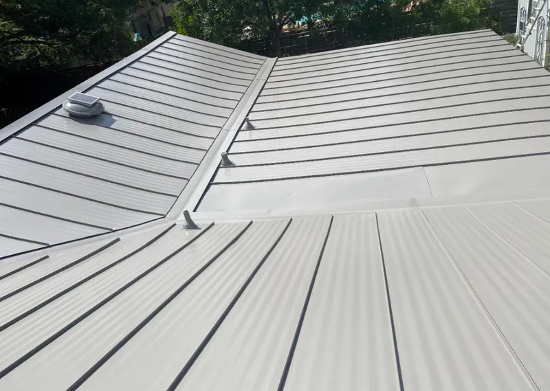 Solar attic fan installed on a metal roof for Roof Ventilation in Macedon